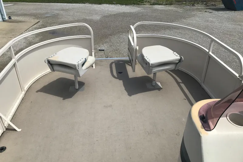 Slide: The Image of 2007 Starcraft Classic 200 CR boat deck with two swivel seats and railing. - 12