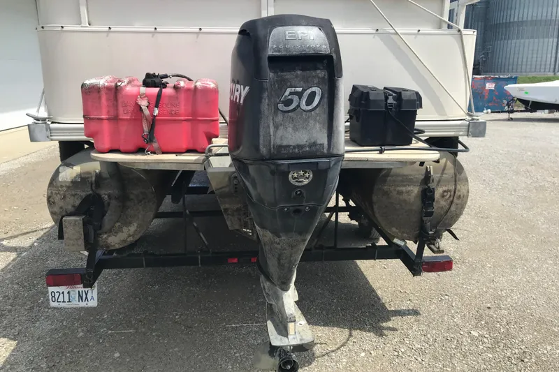 Slide: The Image of 2007 Starcraft Classic 200 CR boat with Mercury 50 outboard motor and fuel containers. - 19