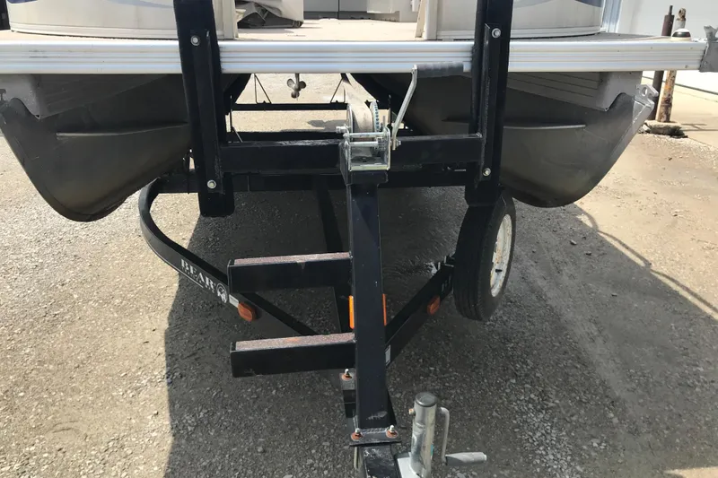 Slide: The Image of 2007 Starcraft Classic 200 CR boat on trailer, rear view, parked on gravel. - 4