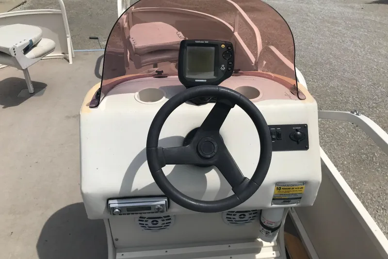 Slide: The Image of Steering console of a 2007 Starcraft Classic 200 CR boat with navigation equipment. - 7
