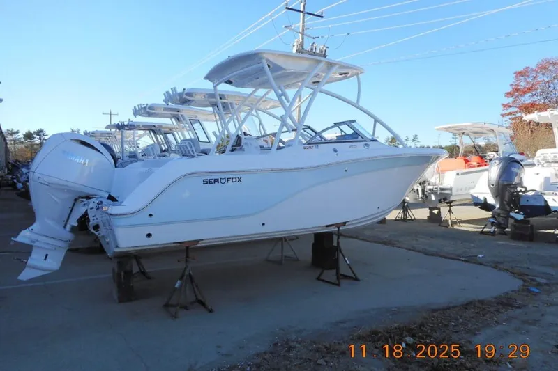 The Image of 2026 Sea Fox 228 Traveler boat on display in a marina setting. - 1