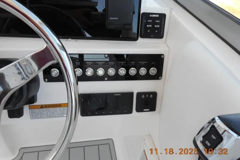 Slide: The Image of Control panel of 2026 Sea Fox 228 Traveler boat with steering wheel and switches. - 11