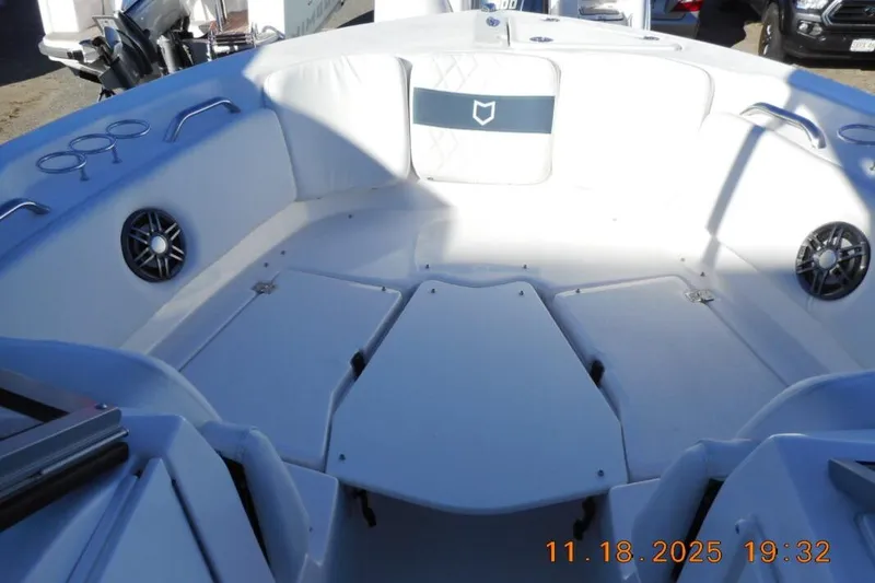 Slide: The Image of Interior view of 2026 Sea Fox 228 Traveler boat, featuring spacious seating and cup holders. - 12