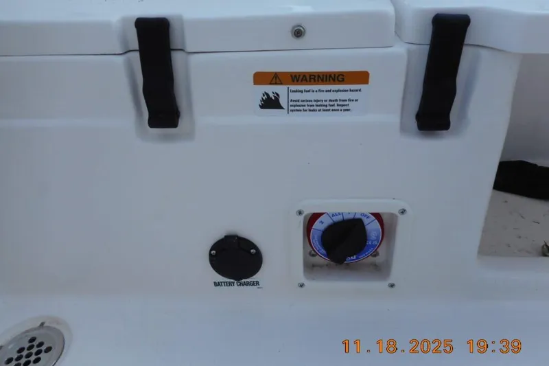 Slide: The Image of 2026 Sea Fox 228 Traveler boat battery charger and warning label. - 14