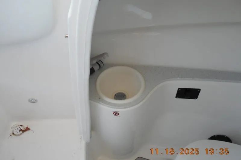 Slide: The Image of Interior view of 2026 Sea Fox 228 Traveler boat, featuring a compact sink area. - 18