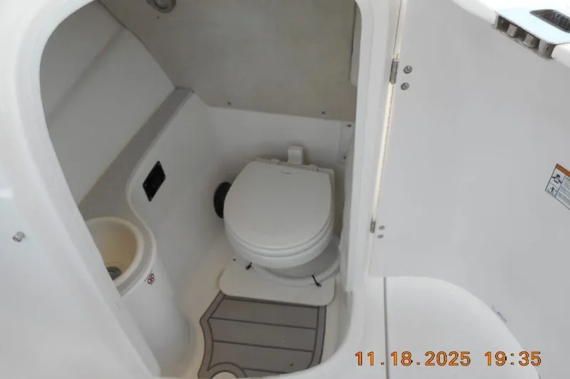 Slide: The Image of 2026 Sea Fox 228 Traveler boat interior with compact marine toilet. - 19