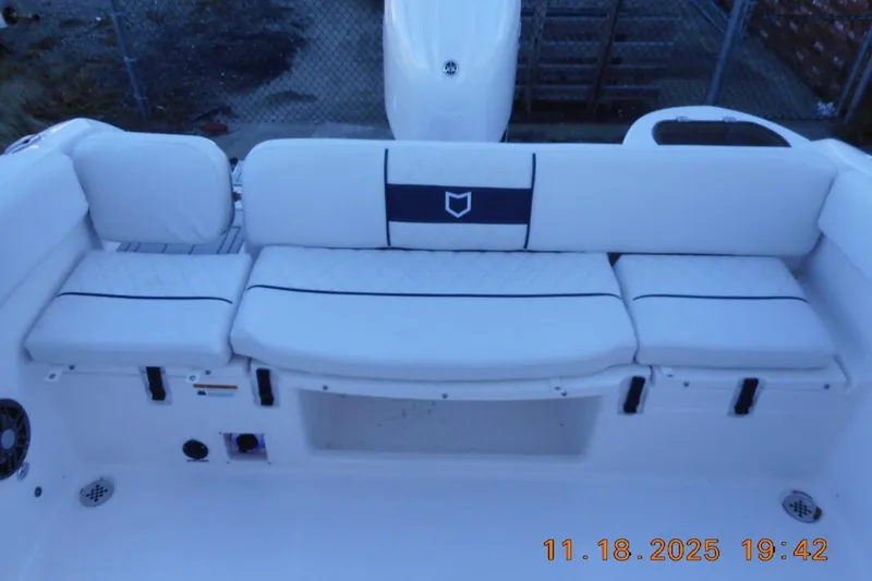 Slide: The Image of 2026 Sea Fox 228 Traveler boat interior with white cushioned seating and storage compartments. - 21