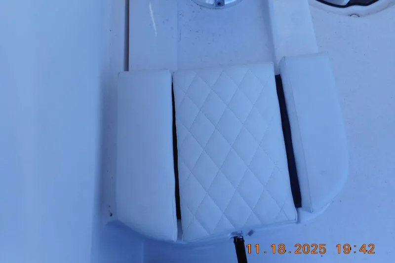 Slide: The Image of White cushioned seat on 2026 Sea Fox 228 Traveler boat, featuring diamond stitching. - 22
