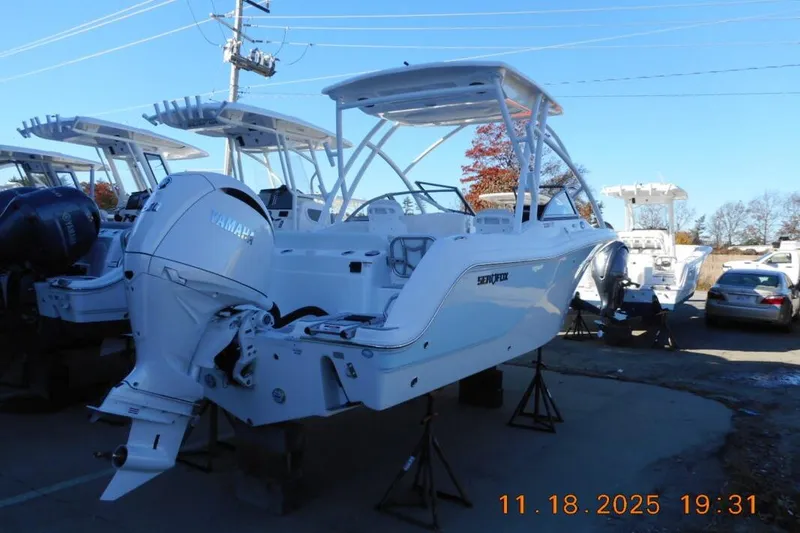 Slide: The Image of 2026 Sea Fox 228 Traveler boat with Yamaha engine on display outdoors. - 6