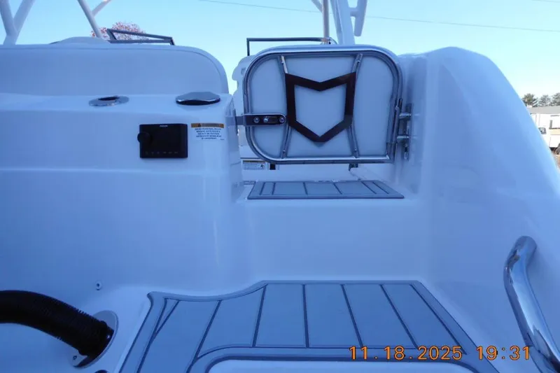 Slide: The Image of Interior view of 2026 Sea Fox 228 Traveler boat, featuring sleek white design and seating area. - 8