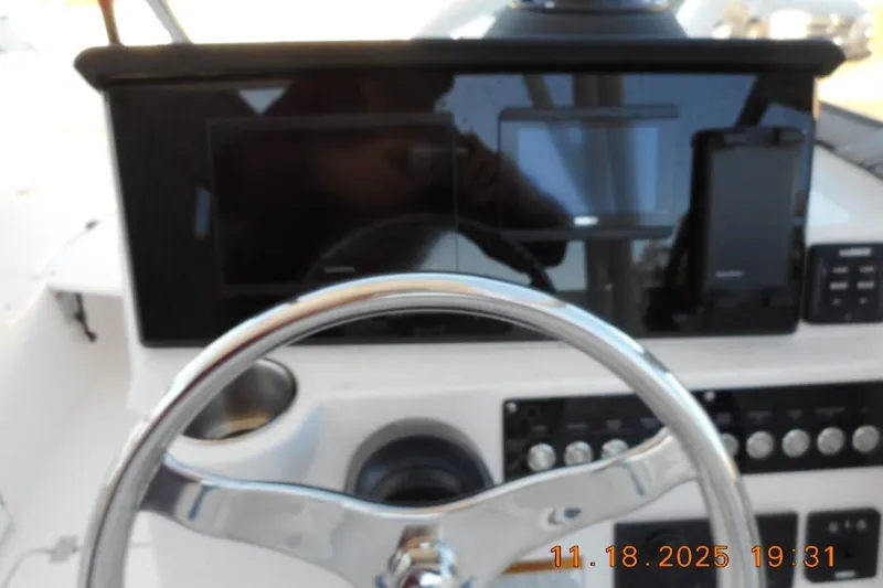 Slide: The Image of Steering console of 2026 Sea Fox 228 Traveler boat with modern navigation displays. - 9
