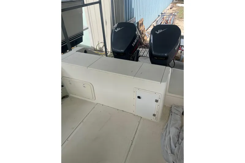 Slide: The Image of 1998 Pursuit 2470 Center Console boat with dual Yamaha 130 engines. - 3