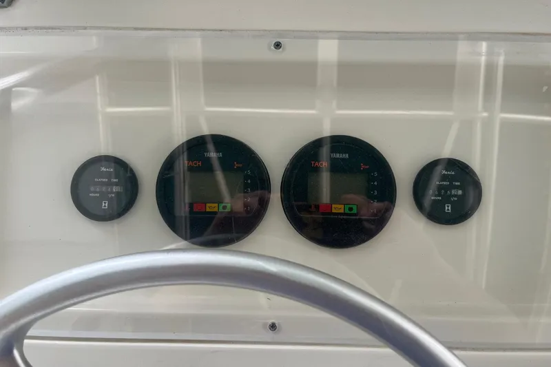 Slide: The Image of Instrument panel of a 1998 Pursuit 2470 Center Console boat with Yamaha tachometers. - 5