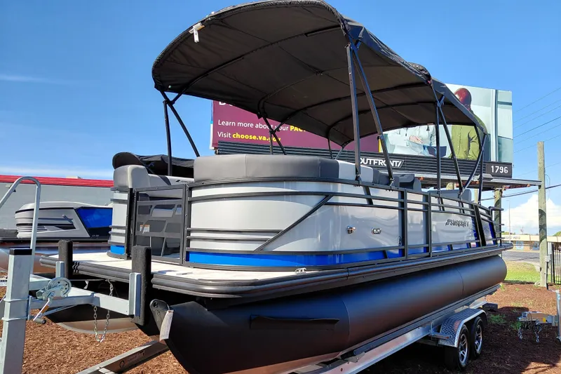The Image of 2026 Starcraft SLS 3 Q DH pontoon boat with canopy on a trailer. - 0