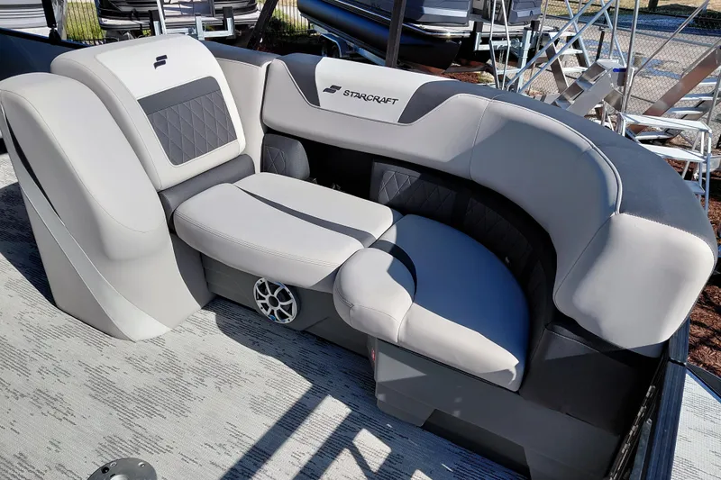 Slide: The Image of 2026 Starcraft SLS 3 Q DH boat interior with luxurious gray seating and speaker system. - 11