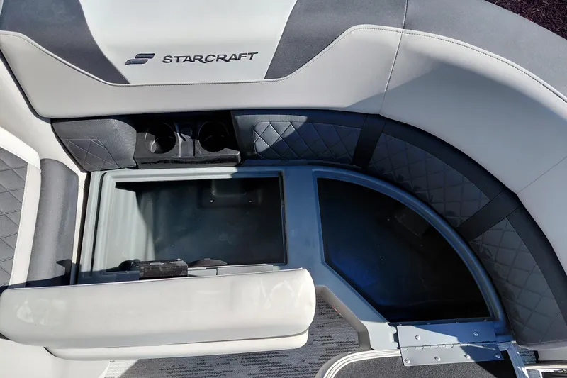 Slide: The Image of Interior of 2026 Starcraft SLS 3 Q DH with seating and cup holders. - 12