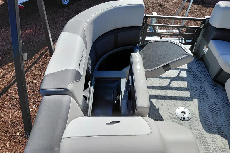 Slide: The Image of 2026 Starcraft SLS 3 Q DH boat interior with gray seating and storage compartment. - 13
