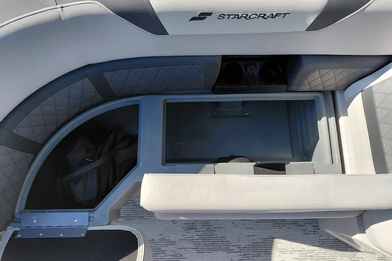 Slide: The Image of Starcraft SLS 3 Q DH 2026 boat interior with storage and cup holders. - 15