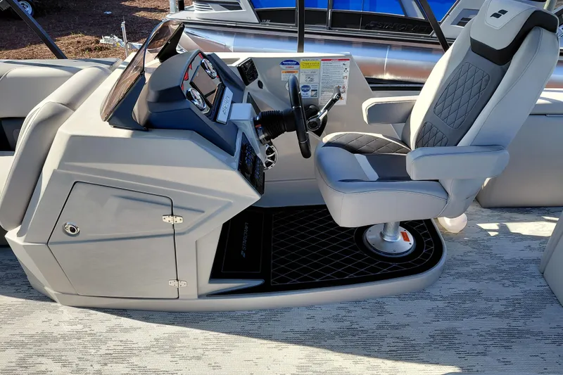 Slide: The Image of Captain's seat and helm of 2026 Starcraft SLS 3 Q DH boat, featuring modern controls. - 17