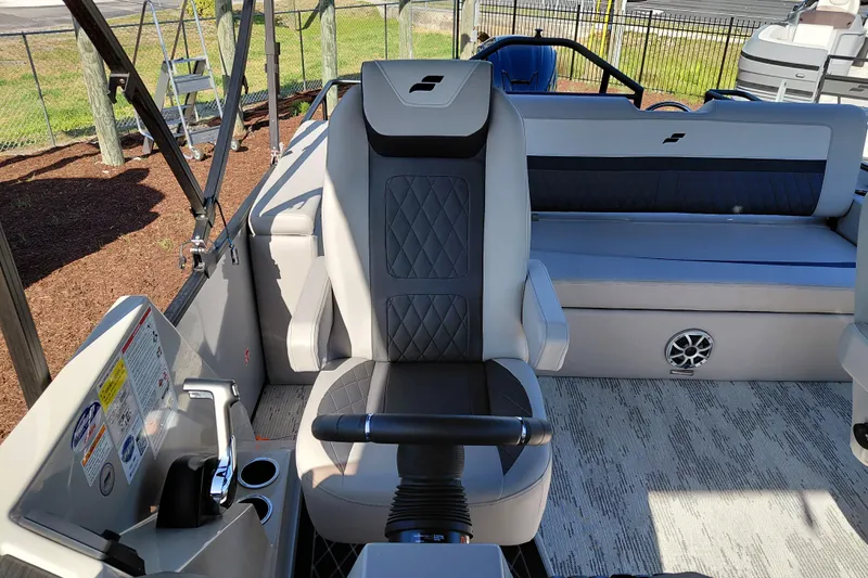 Slide: The Image of Interior of 2026 Starcraft SLS 3 Q DH boat with luxurious seating and modern controls. - 19