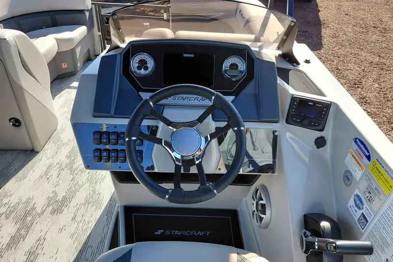 Slide: The Image of Steering console of 2026 Starcraft SLS 3 Q DH boat with modern controls and dashboard. - 20