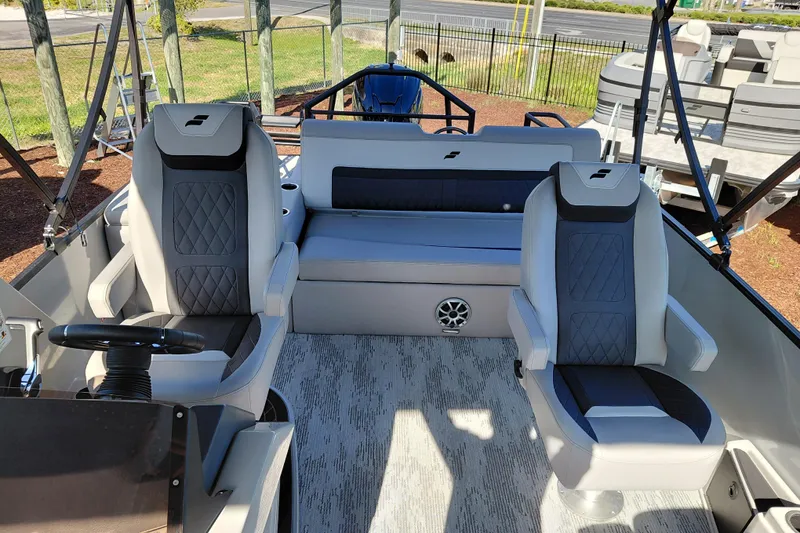 Slide: The Image of 2026 Starcraft SLS 3 Q DH boat interior with modern seating and steering wheel. - 23