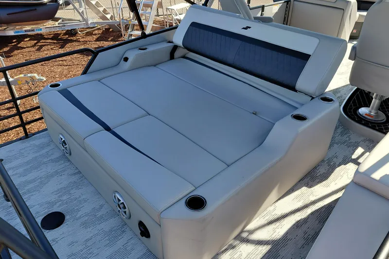 Slide: The Image of Luxurious seating on 2026 Starcraft SLS 3 Q DH boat with cup holders and speakers. - 26