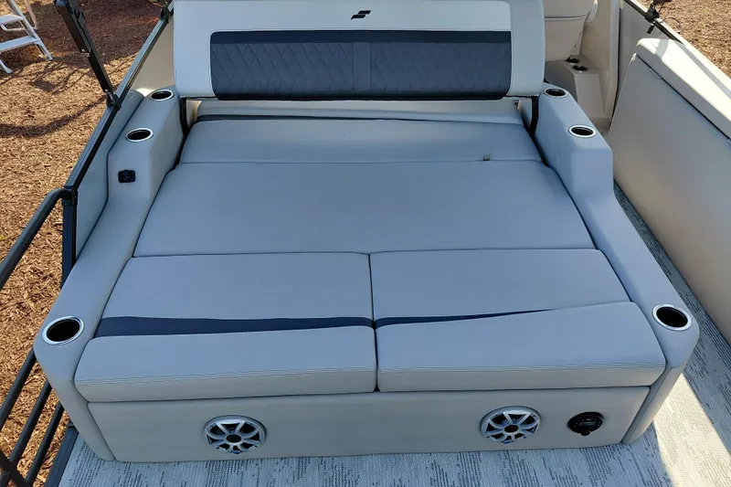 Slide: The Image of Luxurious seating area on 2026 Starcraft SLS 3 Q DH boat with cup holders and speakers. - 27