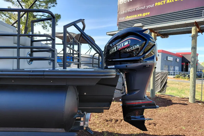 Slide: The Image of 2026 Starcraft SLS 3 Q DH boat with powerful outboard motor, parked outdoors. - 3