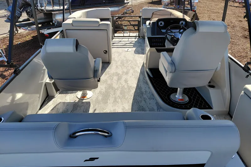 Slide: The Image of Interior view of 2026 Starcraft SLS 3 Q DH boat with modern seating and steering console. - 30