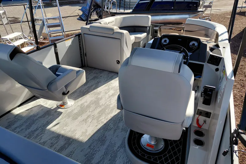 Slide: The Image of 2026 Starcraft SLS 3 Q DH boat interior with modern seating and steering console. - 31