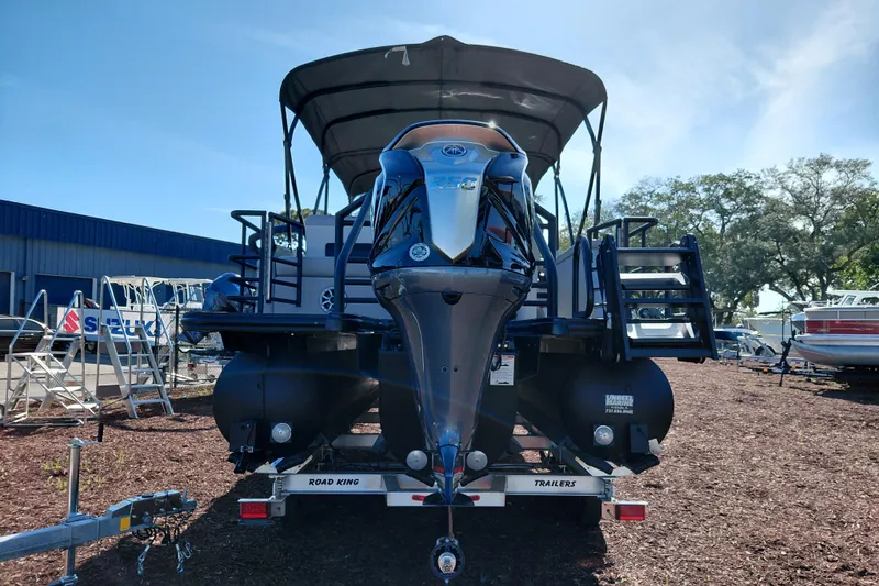 Slide: The Image of 2026 Starcraft SLS 3 Q DH pontoon boat on trailer, rear view. - 4