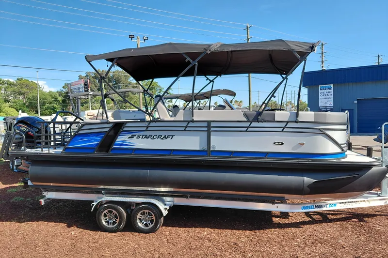 Slide: The Image of 2026 Starcraft SLS 3 Q DH pontoon boat with canopy on trailer. - 6