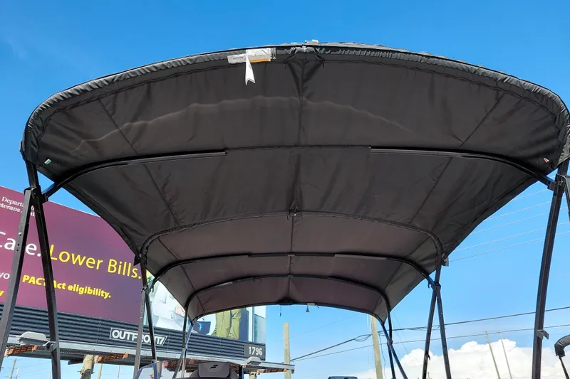 Slide: The Image of 2026 Starcraft SLS 3 Q DH boat canopy against a clear blue sky. - 8
