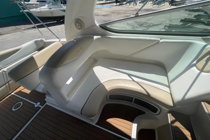 Slide: The Image of 2008 Sea Ray Sundancer 280 interior with beige seating and wood flooring. - 15