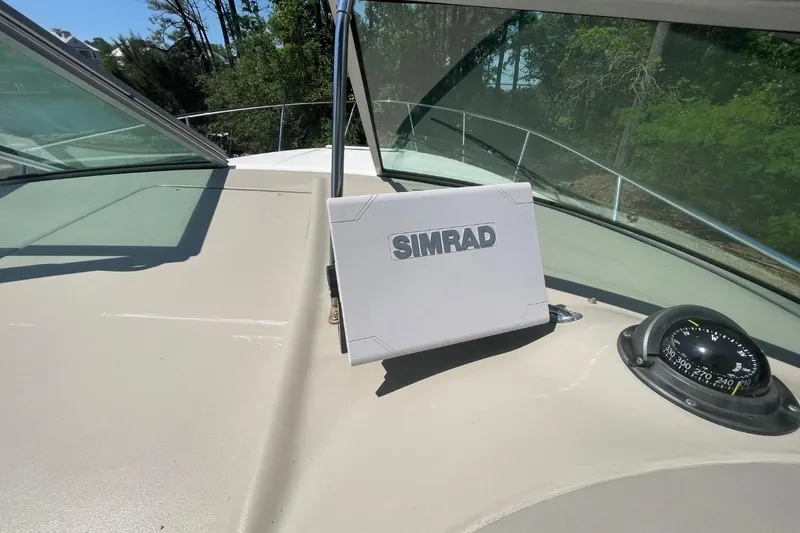 Slide: The Image of 2008 Sea Ray Sundancer 280 dashboard with Simrad navigation system and compass. - 17