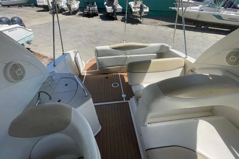 Slide: The Image of 2008 Sea Ray Sundancer 280 interior with beige seating and wood flooring. - 24