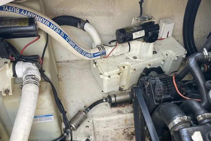 Slide: The Image of Engine compartment of a 2008 Sea Ray Sundancer 280 boat, showing mechanical components. - 31