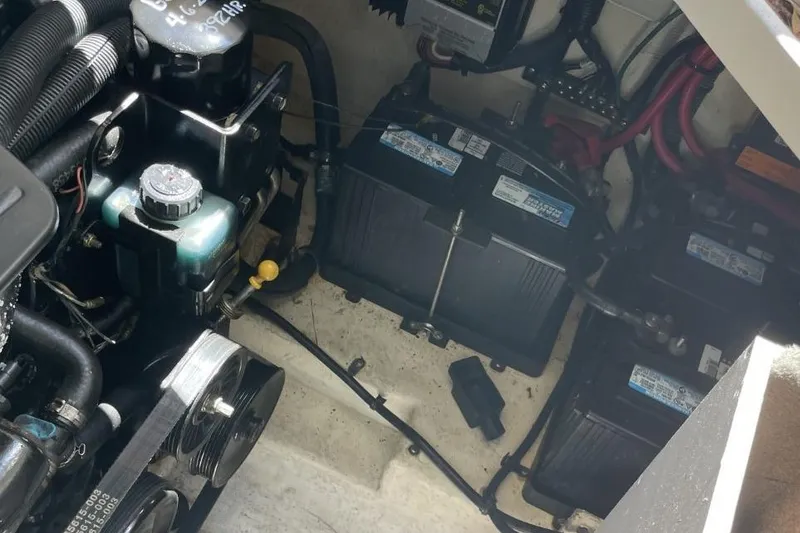 Slide: The Image of Engine compartment of 2008 Sea Ray Sundancer 280 with visible batteries and components. - 32