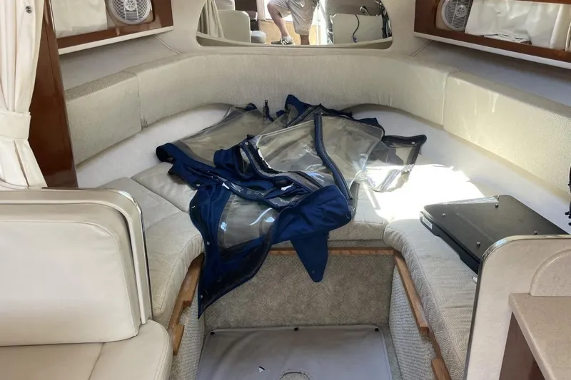 Slide: The Image of Interior of 2008 Sea Ray Sundancer 280 boat with seating and stored covers. - 35