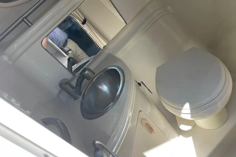 Slide: The Image of Compact bathroom in 2008 Sea Ray Sundancer 280 with sink and toilet. - 42