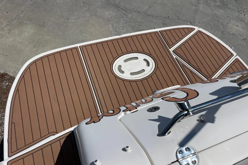 Slide: The Image of 2008 Sea Ray Sundancer 280 swim platform with teak-style decking and stainless steel railing. - 46