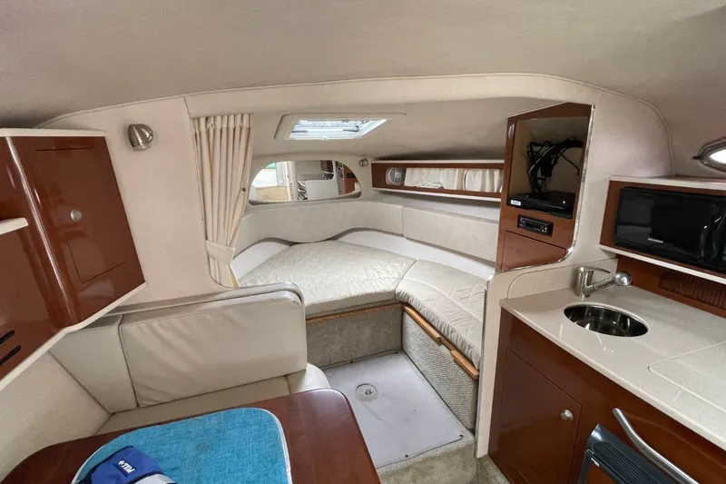 Slide: The Image of Interior of 2008 Sea Ray Sundancer 280 yacht with cozy seating and kitchenette. - 50