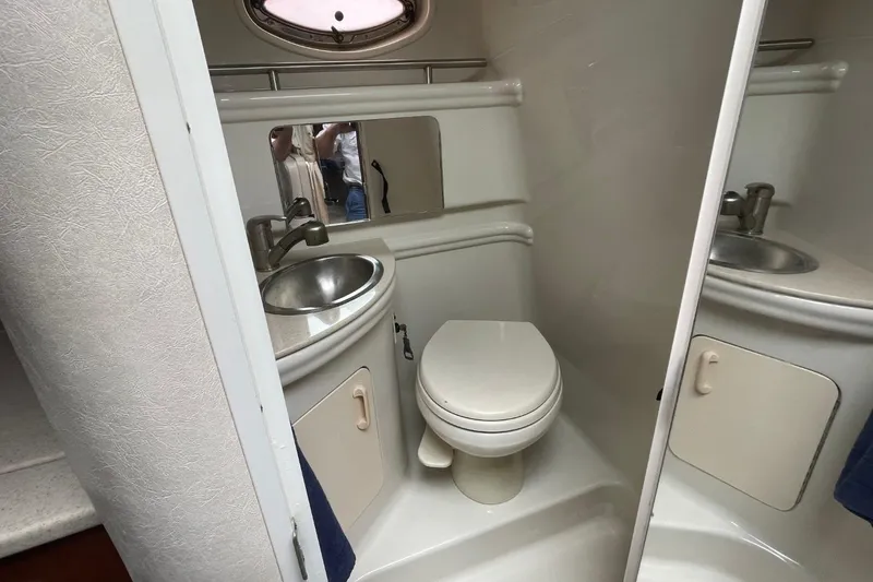 Slide: The Image of 2008 Sea Ray Sundancer 280 bathroom with sink, toilet, and mirror. - 52