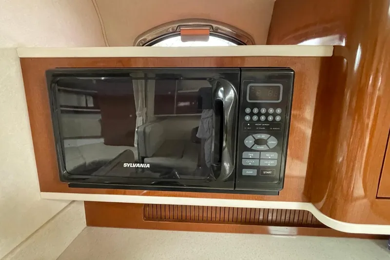 Slide: The Image of Sylvania microwave in 2008 Sea Ray Sundancer 280 yacht kitchen interior. - 53