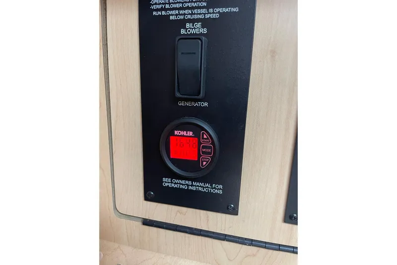 Slide: The Image of Control panel of a 2008 Sea Ray Sundancer 280 boat with Kohler generator display. - 55