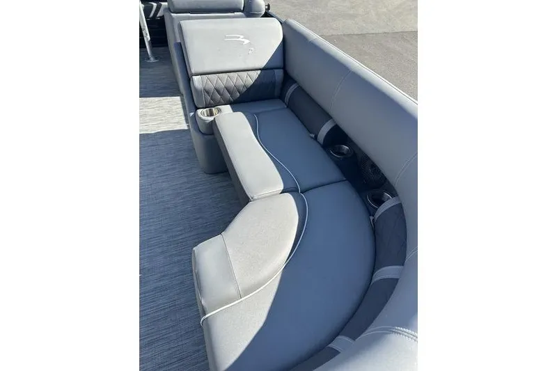 Slide: The Image of 2020 Bennington 21 SSBXP boat interior with gray cushioned seating and cup holders. - 14