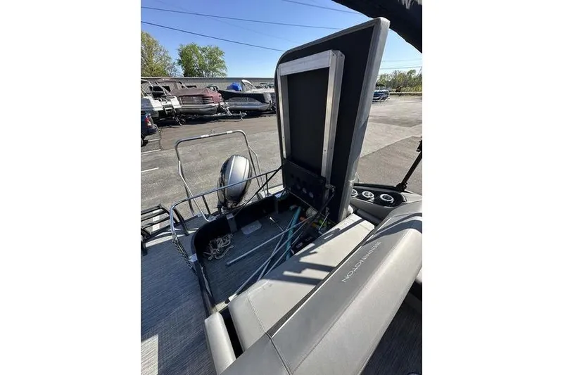 Slide: The Image of 2020 Bennington 21 SSBXP pontoon boat interior with seating and storage area. - 17