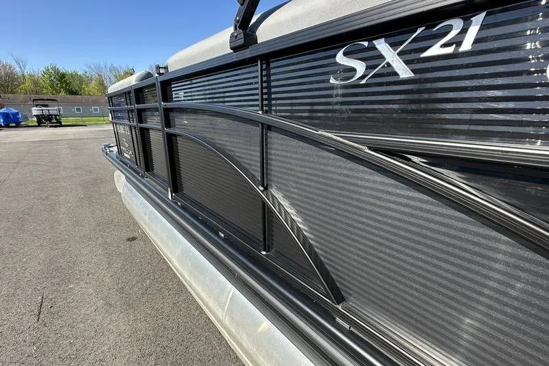 Slide: The Image of 2020 Bennington 21 SSBXP pontoon boat, side view with SX21 branding. - 18