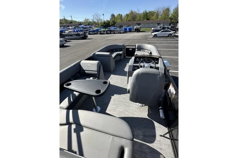 Slide: The Image of 2020 Bennington 21 SSBXP pontoon boat interior with gray seating and steering console. - 20